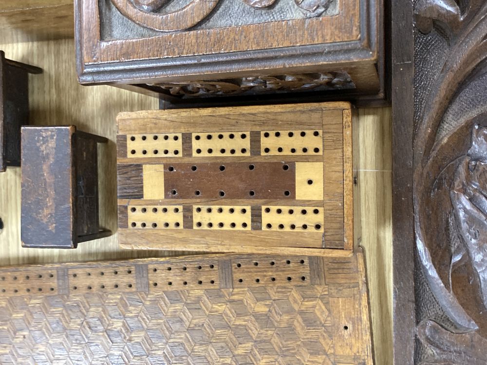Three inlaid wooden boxes, a carved oak box, two cribbage boards and sundry treen, 19th/20th century